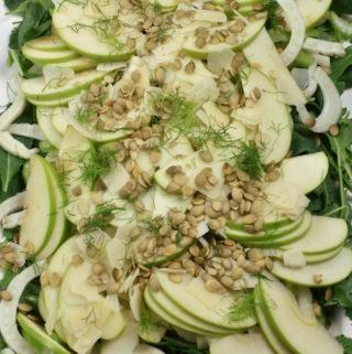 Close-up of apple fennel salad on a platter.